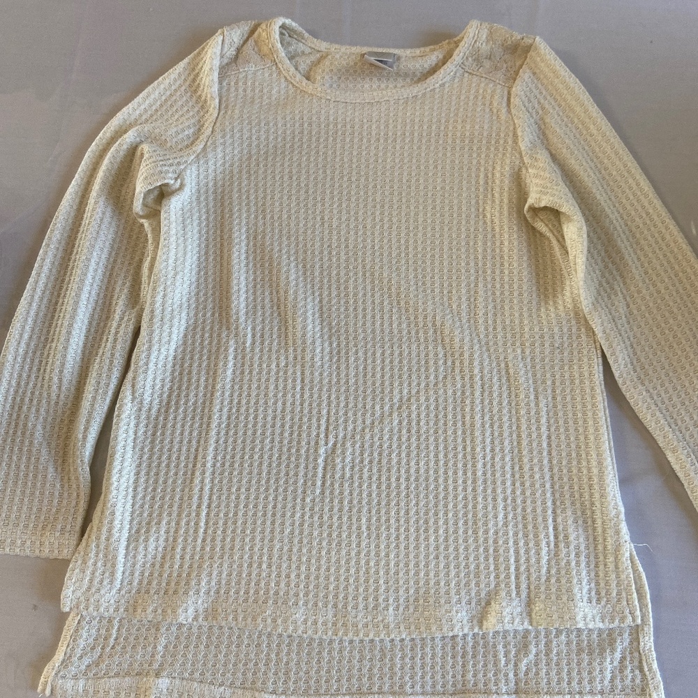 Cream and gold shirt with lace top of shoulder
